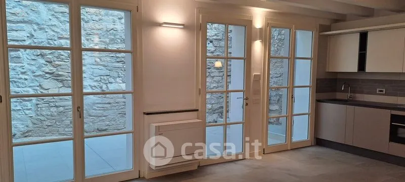 Kitchen - Elegant Trilocale with Private Patio in Como