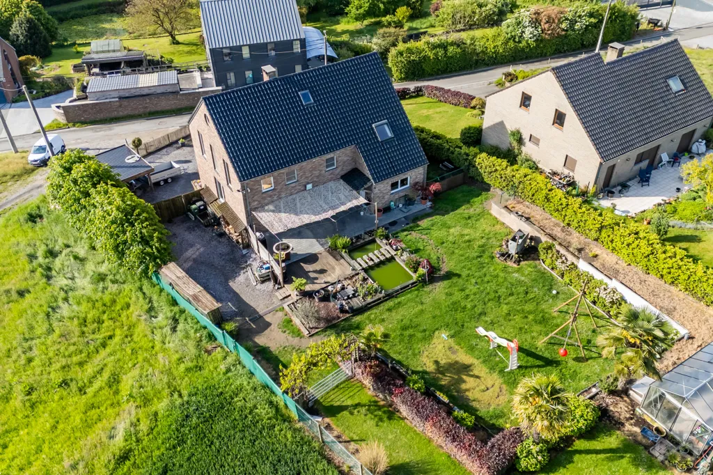 Aerial - House with Photovoltaic Panels in Courcelles