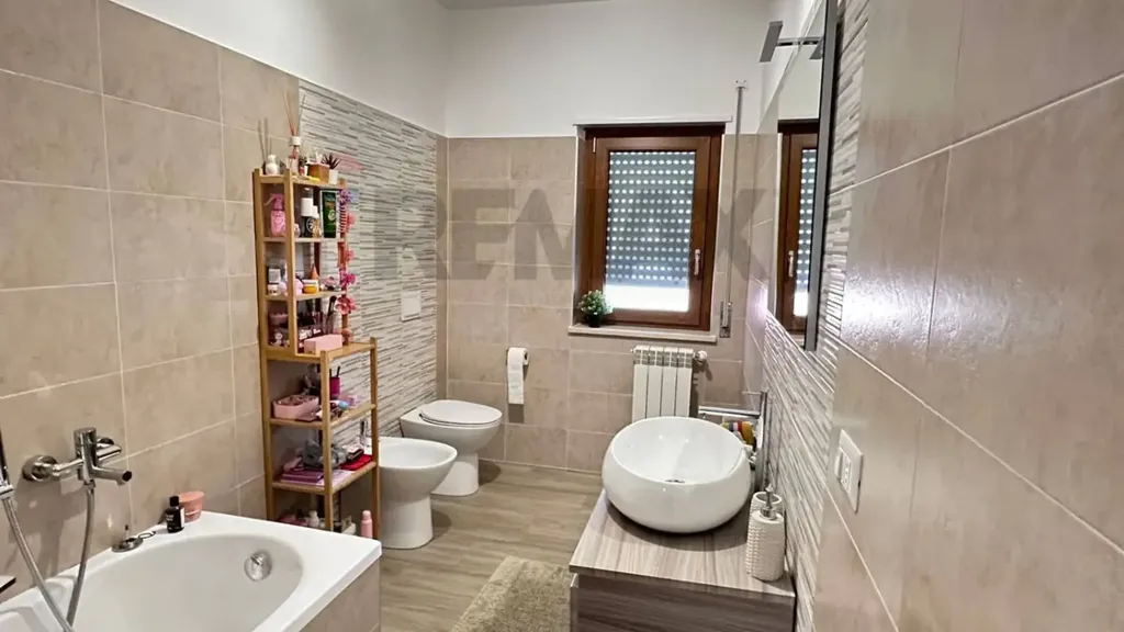 Bathrooms - Modern Apartment with Balcony in Cosenza