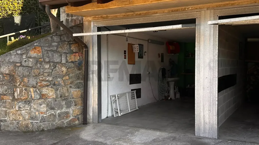 Garage - Mountain View Apartment with Garden in Orezzo