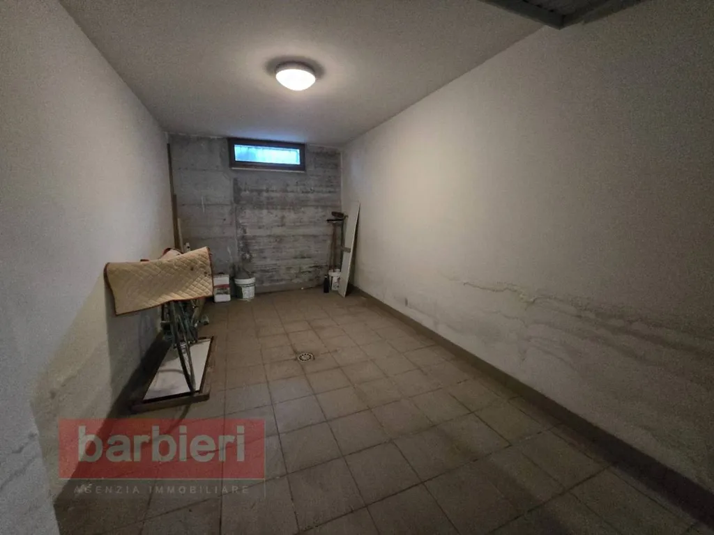 Garage - Three-Bedroom Apartment with Terrace in Cervia