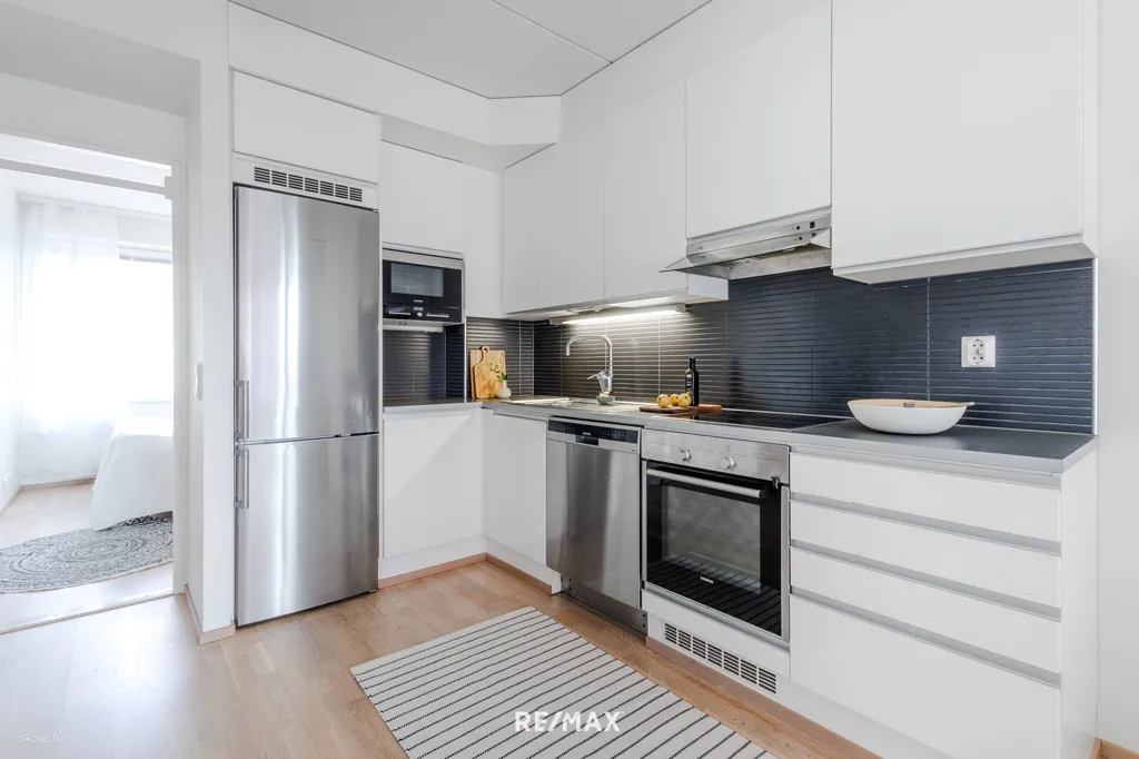 Kitchen - Modern Apartment with West-Facing Terrace in Länsi-Pasila