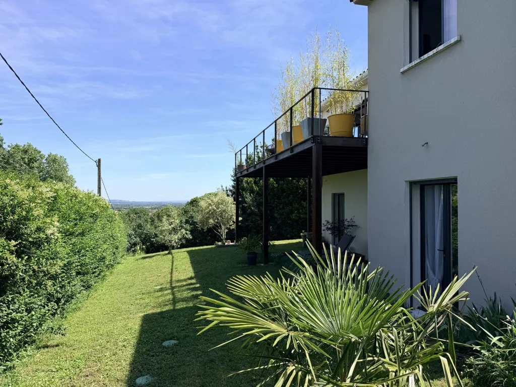 Garden - Contemporary House with Panoramic View in Green Setting