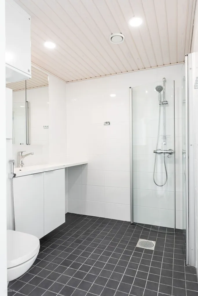 Bathrooms - Modern Apartment with Balcony in Oulu