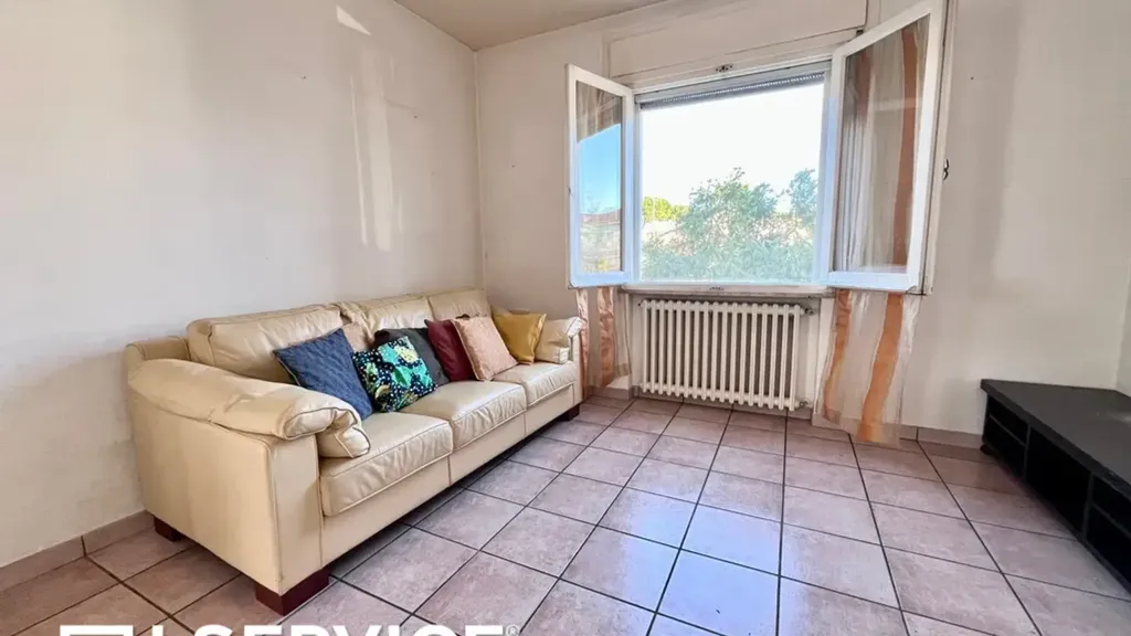 Séjour - Three-Bedroom Apartment with Balcony in Cervia