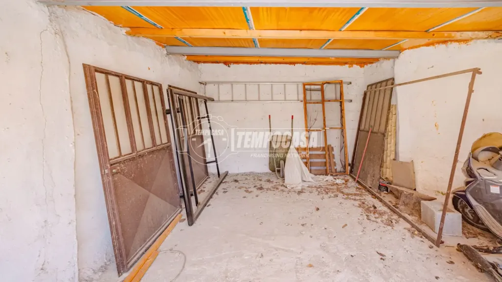 Garage - Spacious Triplex with Balcony in Vigevano