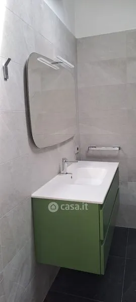 Bathrooms - Elegant Trilocale with Private Patio in Como
