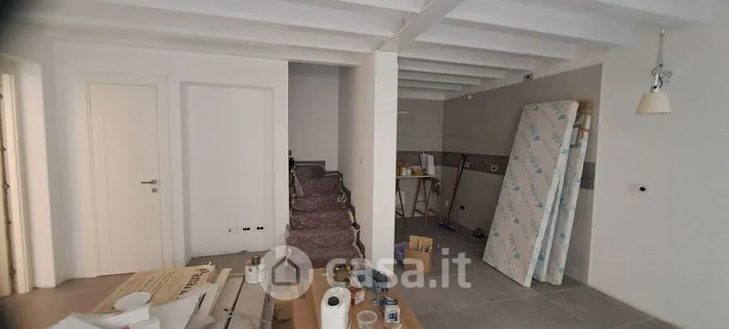 Living Room - Elegant Trilocale with Private Patio in Como