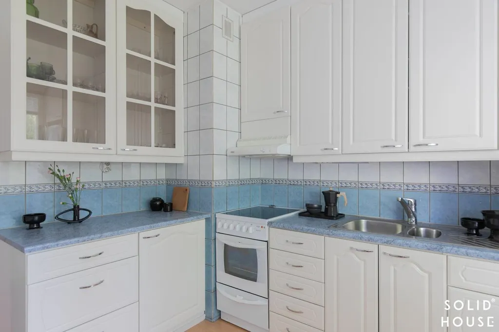 Kitchen - Spacious Apartment with Balcony in Laitila