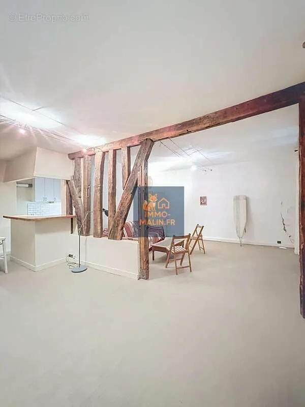 Living Room - Bright Studio Apartment with Poutres in Paris 4th