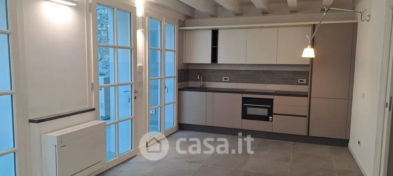 Kitchen - Elegant Trilocale with Private Patio in Como