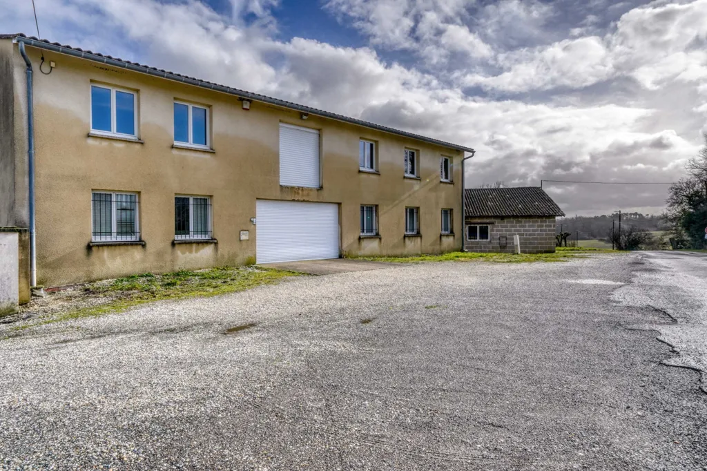 Multi-Level Building with Parking in Maransin