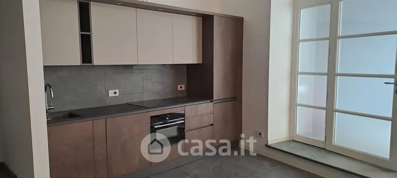 Kitchen - Elegant Trilocale with Private Patio in Como