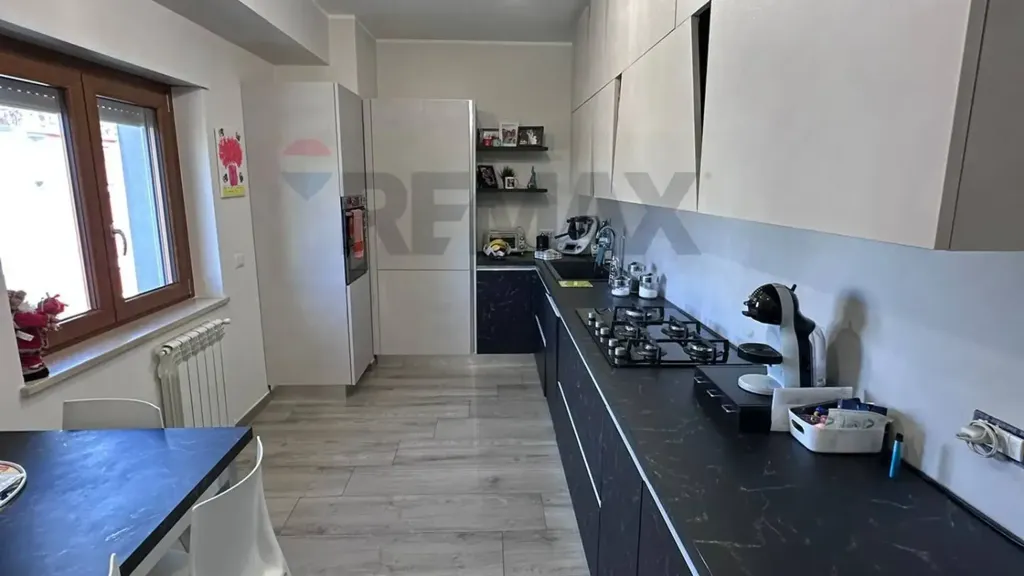 Kitchen - Modern Apartment with Balcony in Cosenza