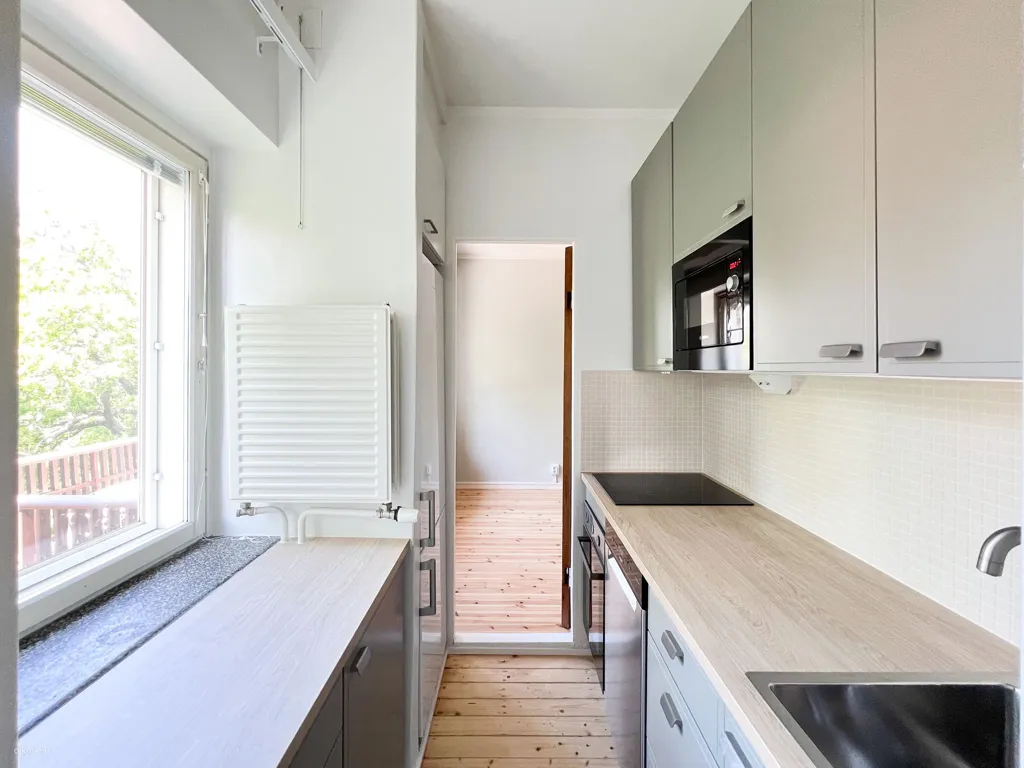 Kitchen - Upper Floor Apartment with Balcony in Toukola, Helsinki