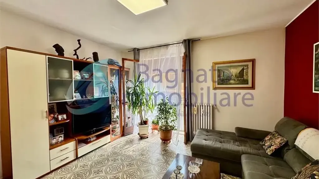 Séjour - Three-Bedroom Apartment with Balcony in Novara