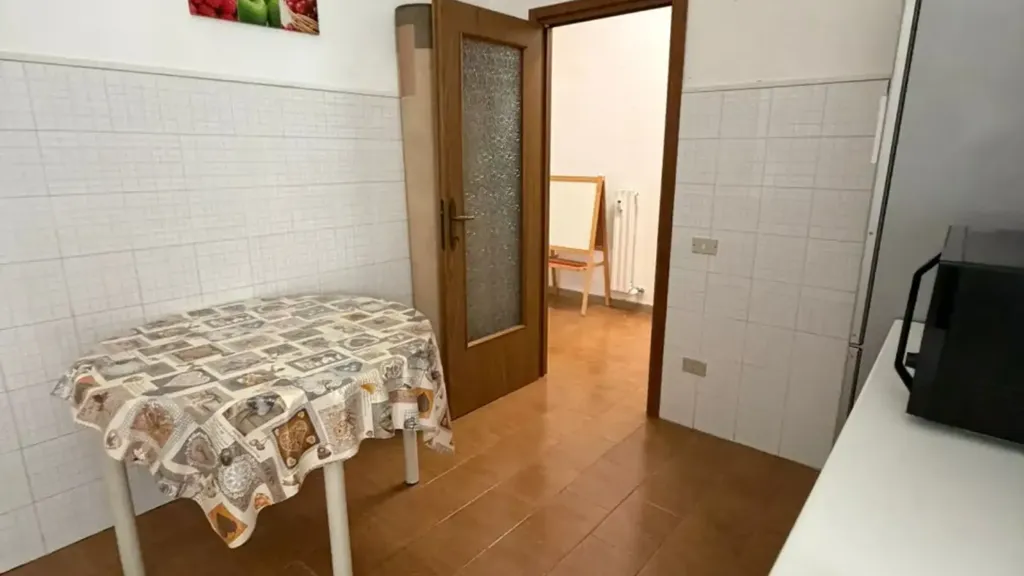 Dining Room - Three-Bedroom Apartment with Balcony in Parma