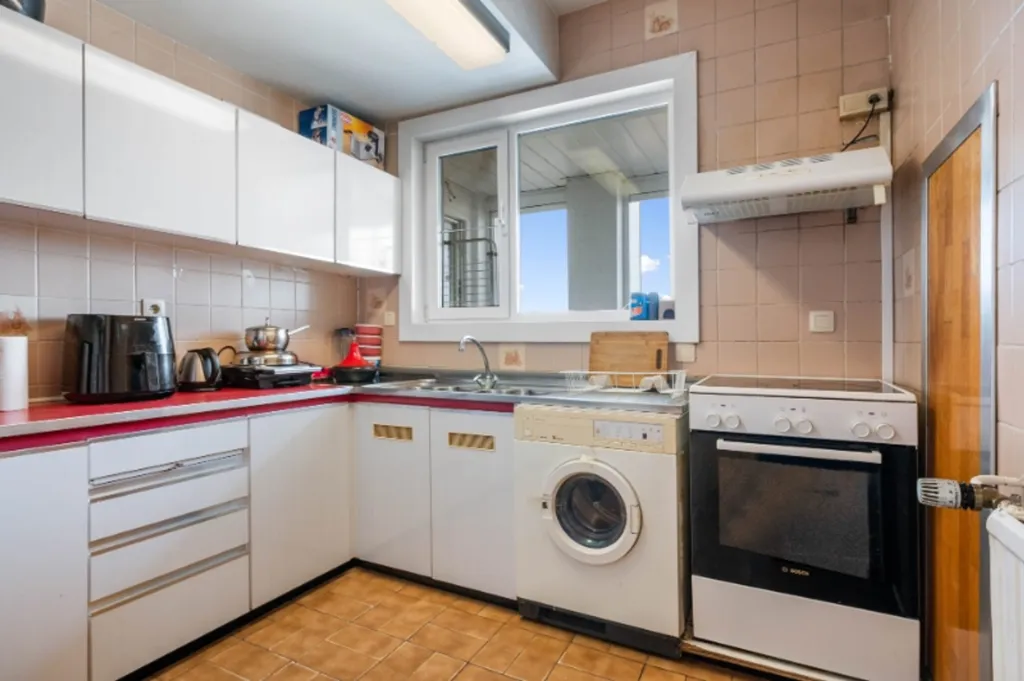 Kitchen - Spacious Apartment with City View in Aalst