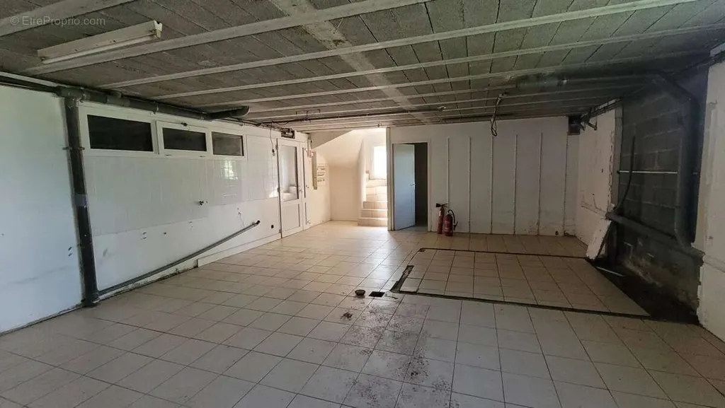 Garaaž - House with Commercial Space in Saint-Agrève