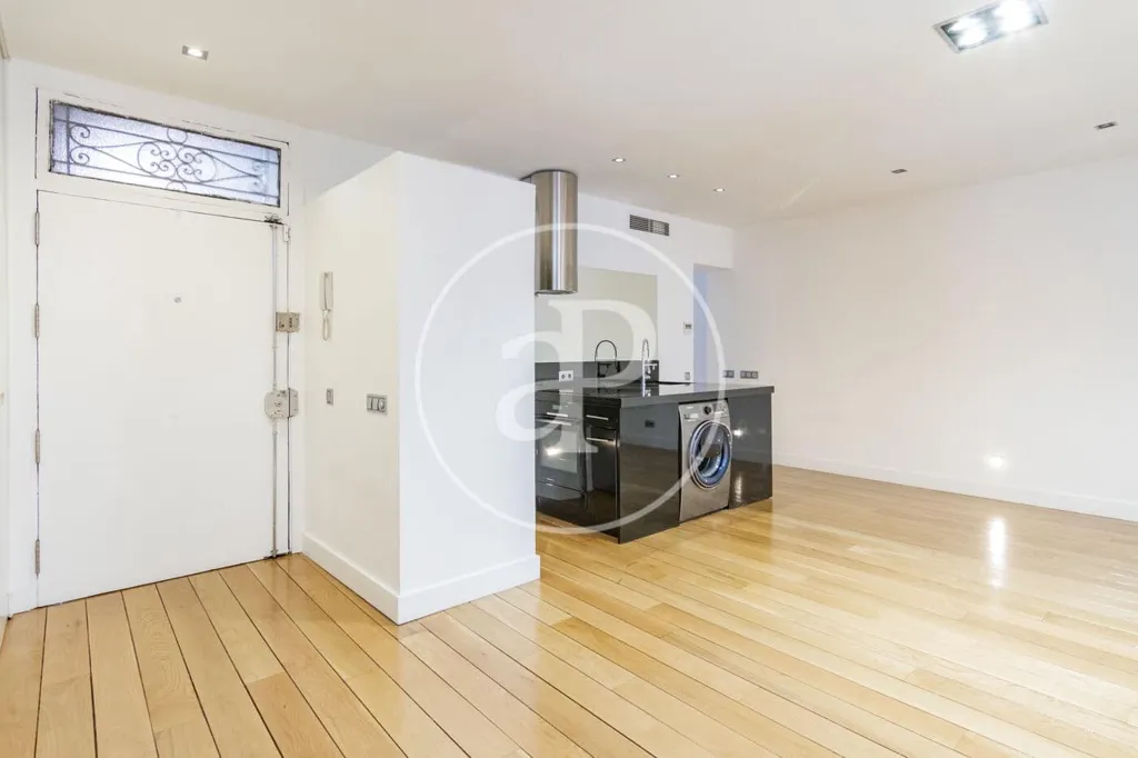Living Room - Modern Apartment with Balcony Views in Madrid Centre