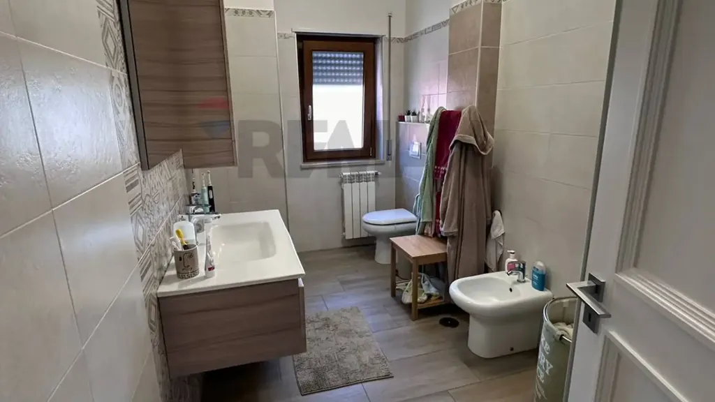 Bathrooms - Modern Apartment with Balcony in Cosenza