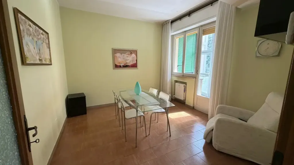 Dining Room - Three-Bedroom Apartment with Balcony in Parma