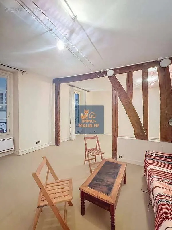Living Room - Bright Studio Apartment with Poutres in Paris 4th