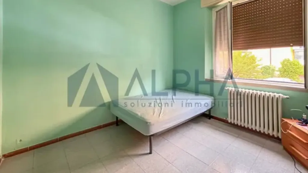 Bedrooms - Three-Bedroom Apartment with Balcony in Forlì