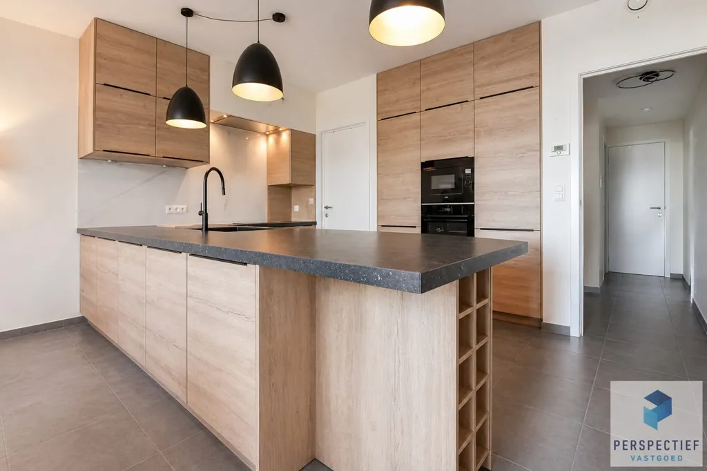 Cuisine - Appartement avec Jardin et Terrasse à Proximité des Commodités