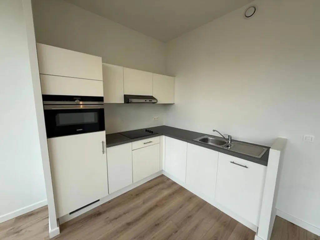 Cuisine - Appartement Moderne avec Terrasse à l'Oudevaar