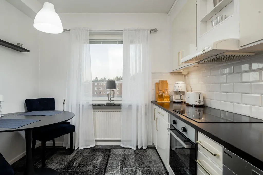 Cuisine - Renovated Two-Bedroom Flat with Balcony in Gävleborg