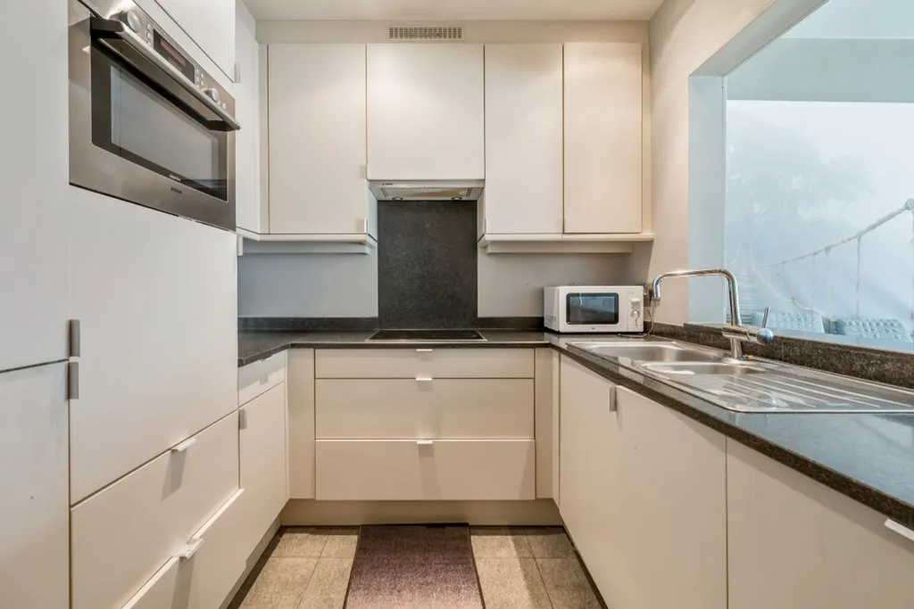 Kitchen - Central Apartment with Private Parking in Beveren