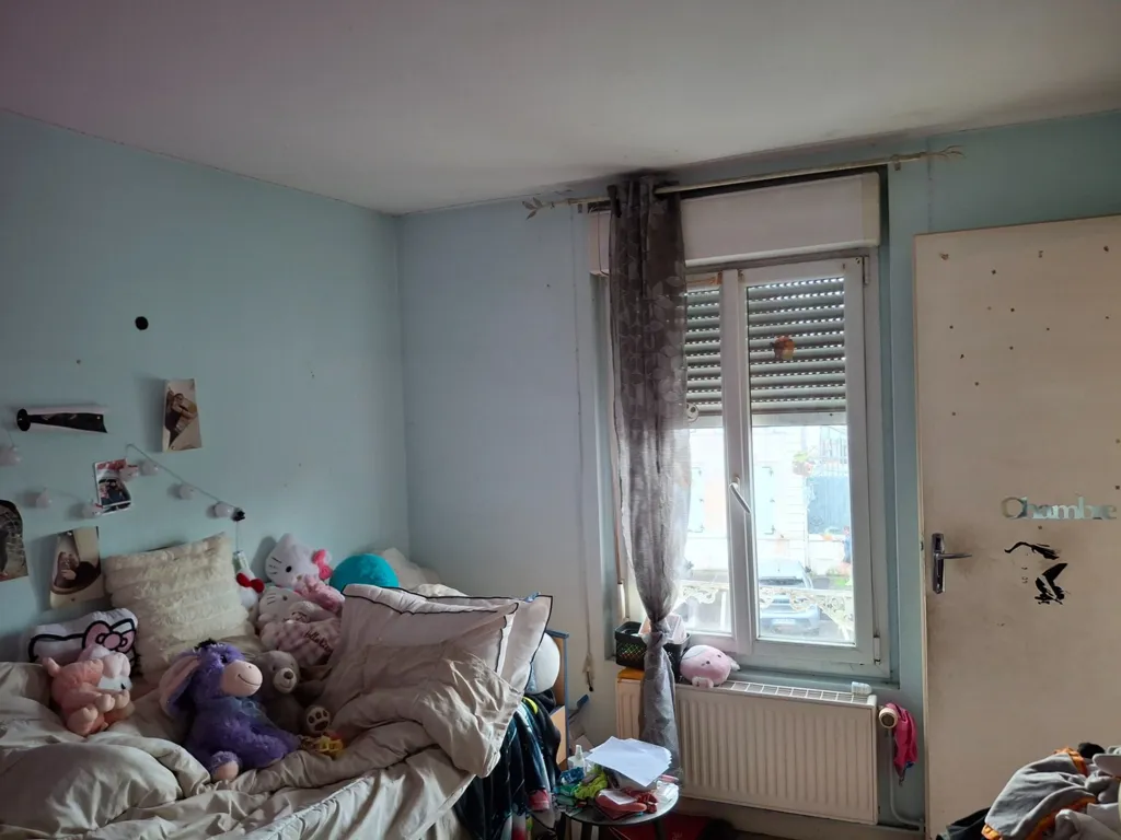 Bedrooms - Mixed-Use Building with Commercial Space in Saint-Dizier