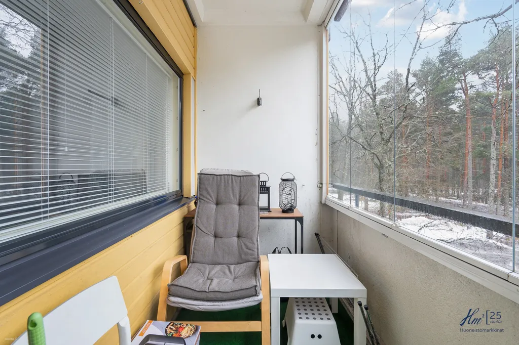 Balcony - Two-Bedroom Flat with Garden View in Runosmäki