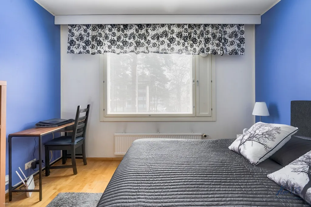Bedrooms - Two-Bedroom Flat with Garden View in Runosmäki