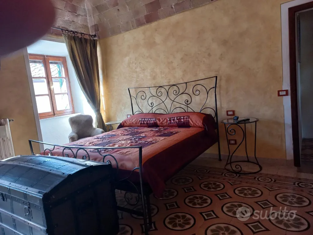 Chambres - Restored Apartment with Terrace in Pomarance
