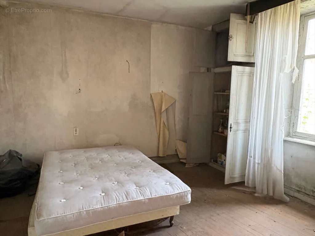 Bedrooms - Mixed-Use Building with Commercial Potential in Saint Yrieix