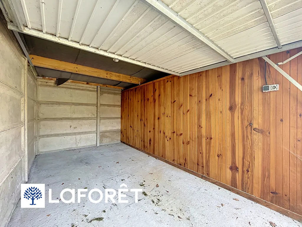 Garage - Two-Level Apartment with Private Garden in Ligné