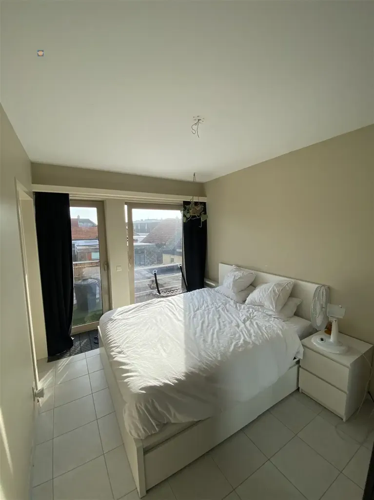 Chambres - Appartement avec Terrasse et Cuisine Équipée à Proximité des Commodités