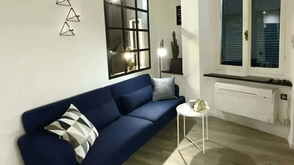 Living Room - Furnished Studio with Air Conditioning in Genoa