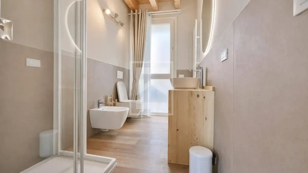 Bathrooms - Restored Triplex with Garden View in Manerba del Garda