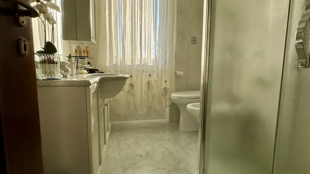 Bathrooms - Spacious Penthouse with Triple Exposure in Brescia