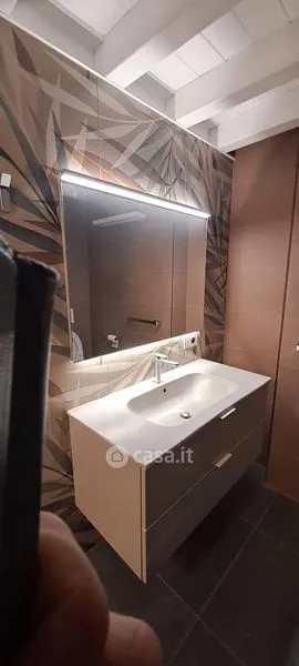 Bathrooms - Elegant Trilocale with Private Patio in Como