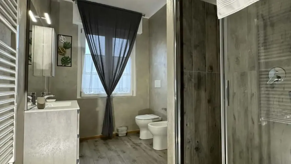 Bathrooms - 1-Bedroom Apartment with Private Parking in Basiglio