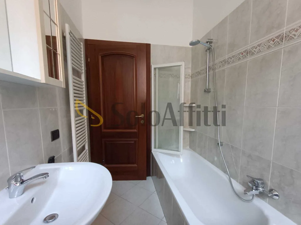 Bathrooms - Three-Bedroom Flat with Balcony in Central Location