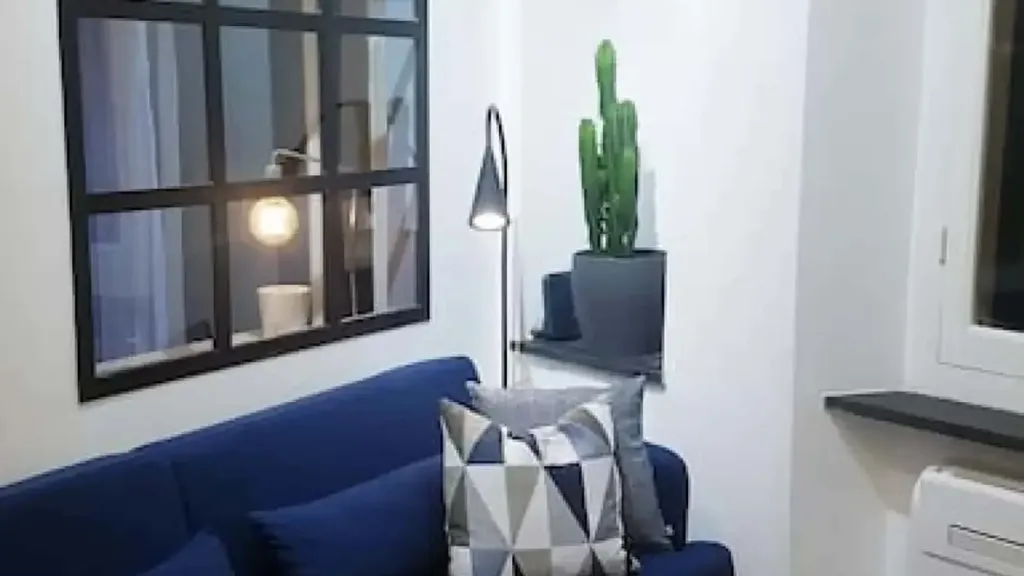 Living Room - Furnished Studio with Air Conditioning in Genoa
