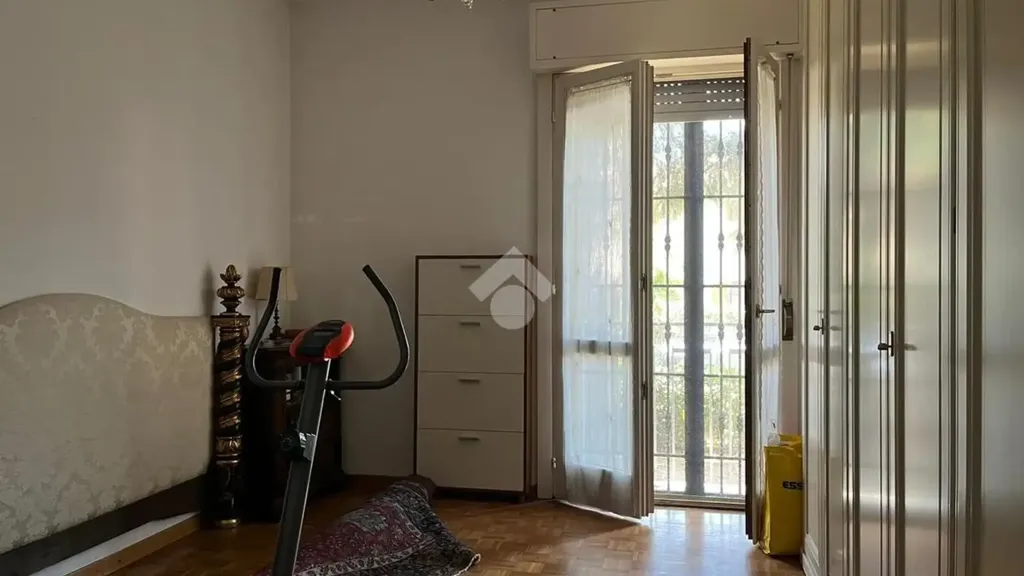 Bedrooms - Three-Bedroom Apartment with Balcony in Melegnano