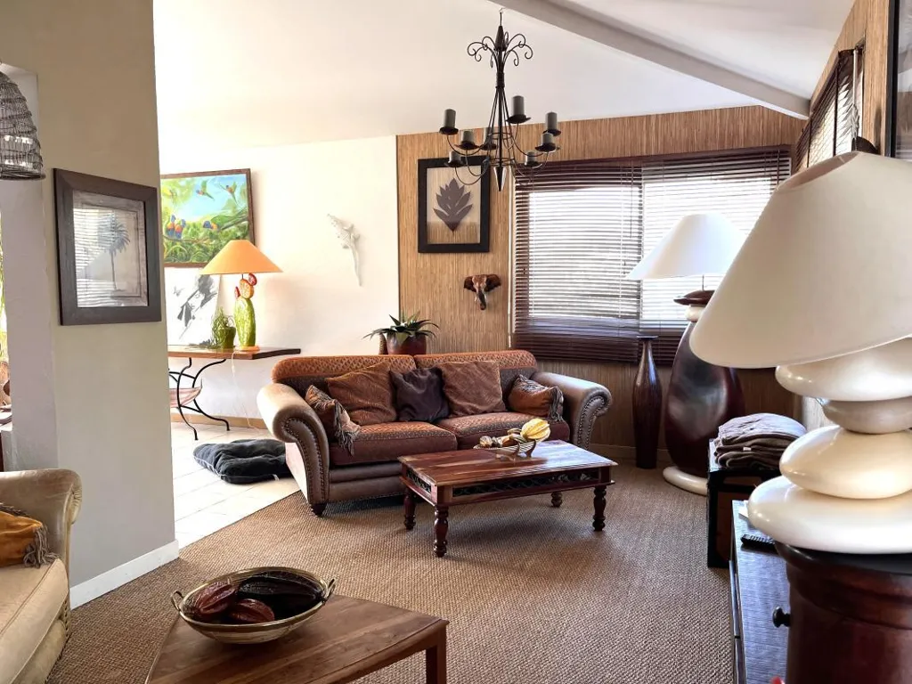 Living Room - House with Mountain View in Verdant Setting