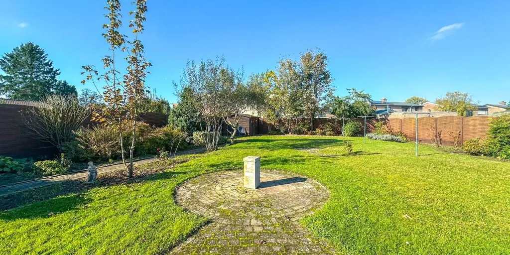 Jardin - Appartement Charmant avec Garage à Heusden