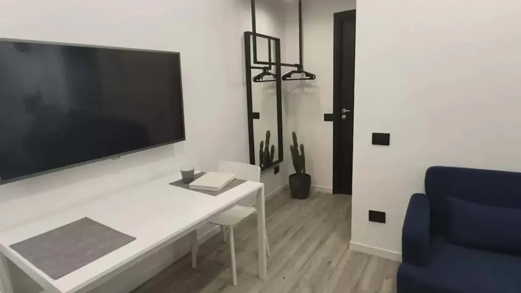 Living Room - Furnished Studio with Air Conditioning in Genoa